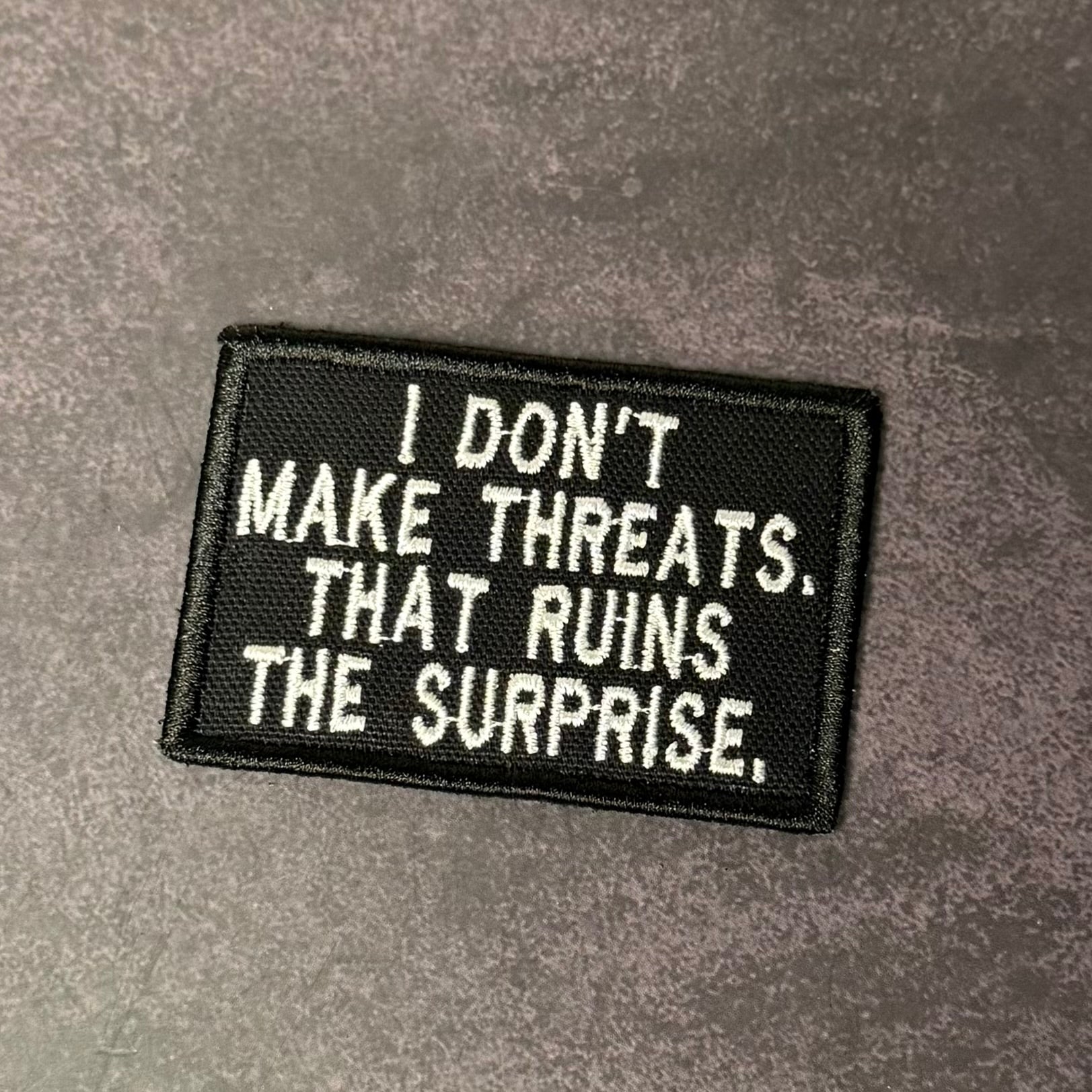 I Don't Make Threats, That Ruins The Surprise Funny Morale Patch | Made in USA | VELCRO® Brand Hook Backing