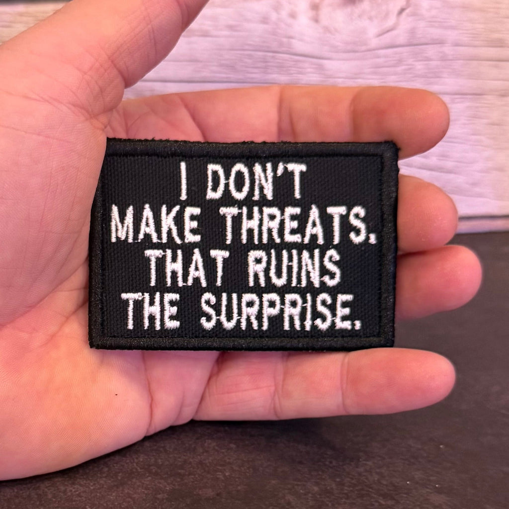 I Don't Make Threats, That Ruins The Surprise Funny Morale Patch | Made in USA | VELCRO® Brand Hook Backing